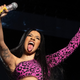 Cardi B sticks her tongue out onstage